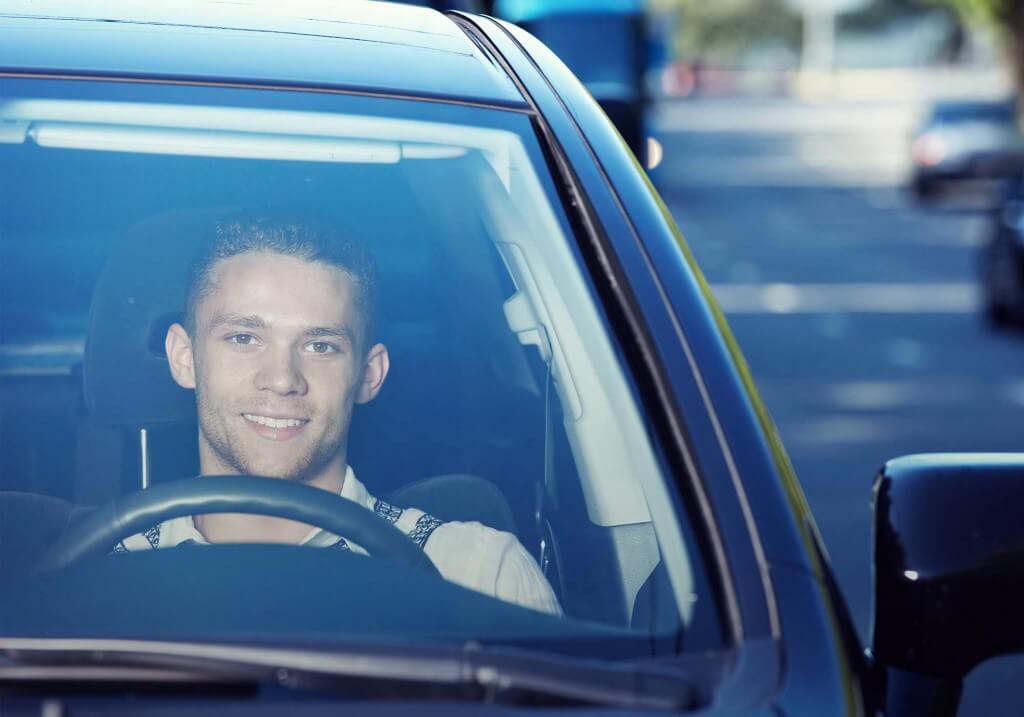 young man in car | insurethebox